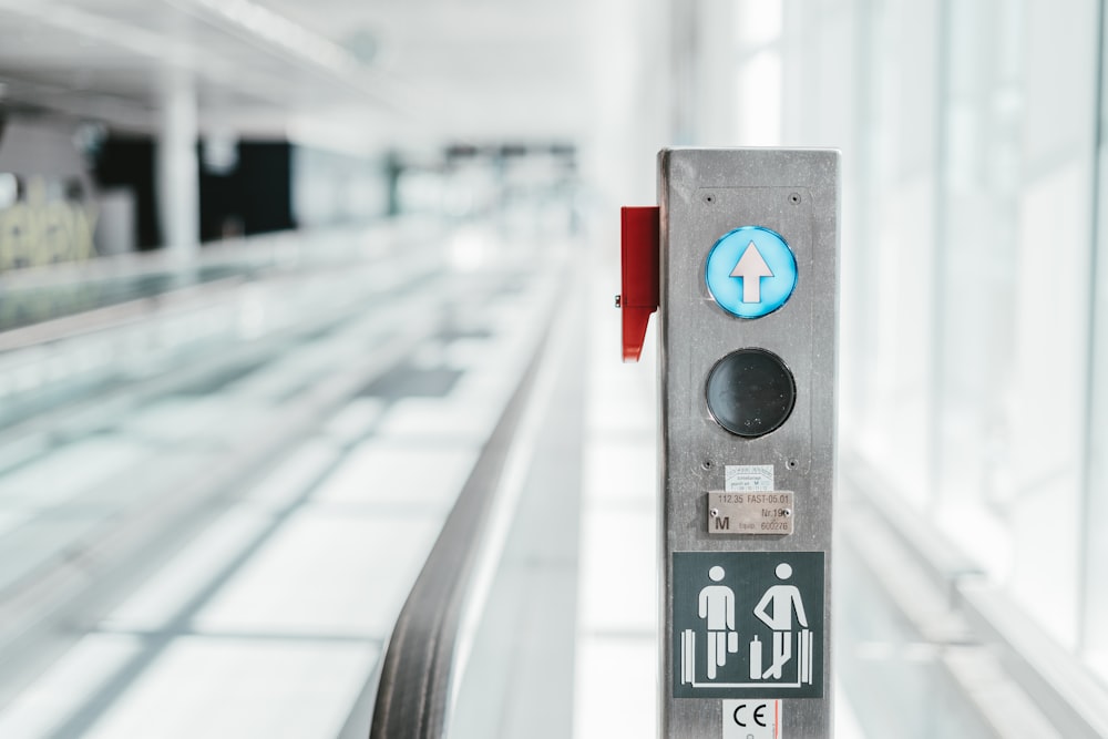 selective focus photo of escalator button