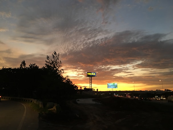 A colorful sunset behind our dumpsters, highlighting our brand.