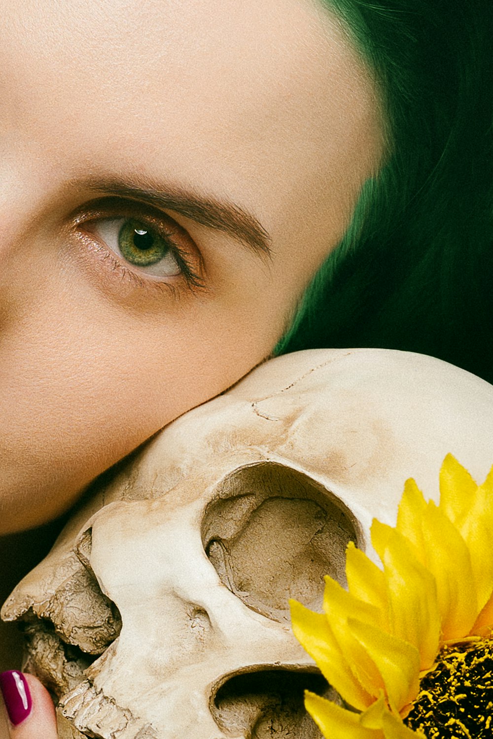 woman taking selfie with skull