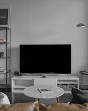 flat screen TV displaying black screen