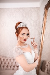 woman in white wedding gown facing the mirror onlyfans