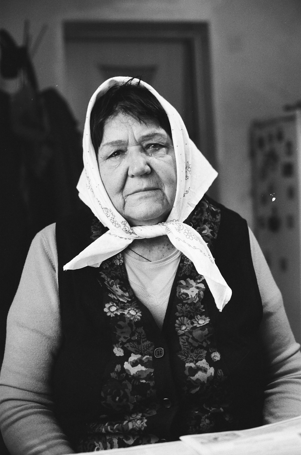 woman wearing headdress and vest