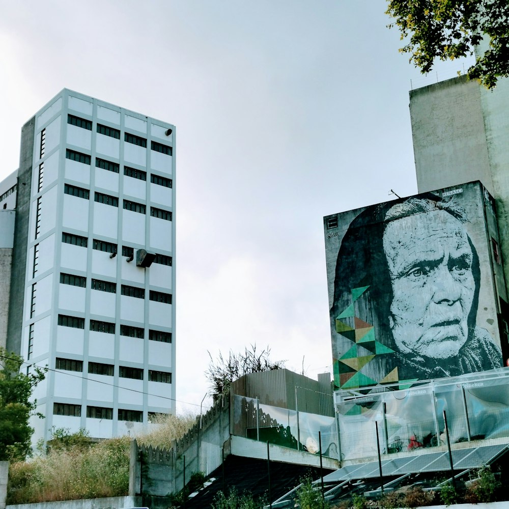 old woman poster near building