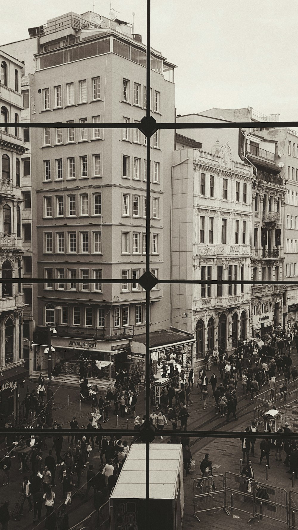 greyscale photography of people near building