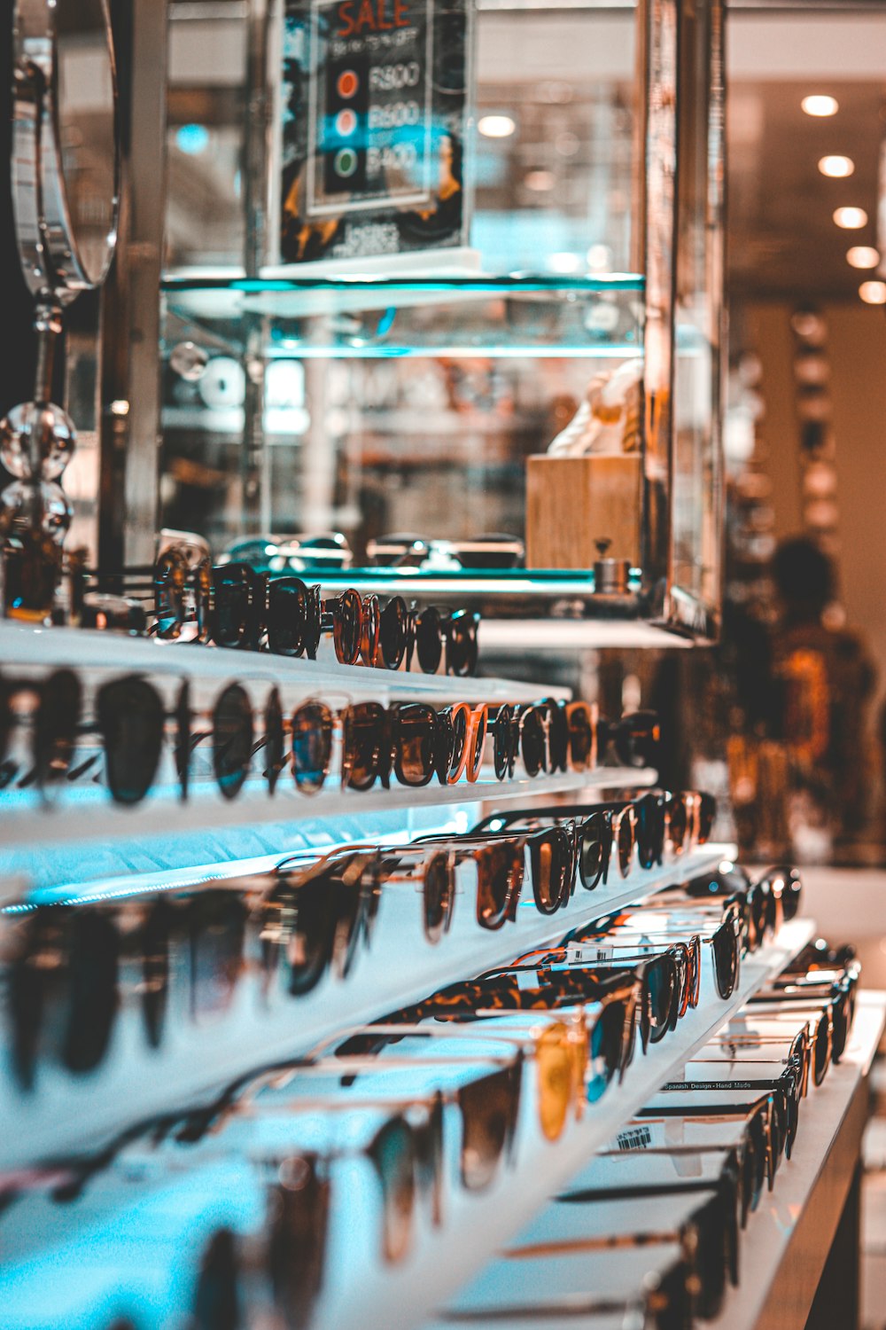 assorted sunglasses on display at store