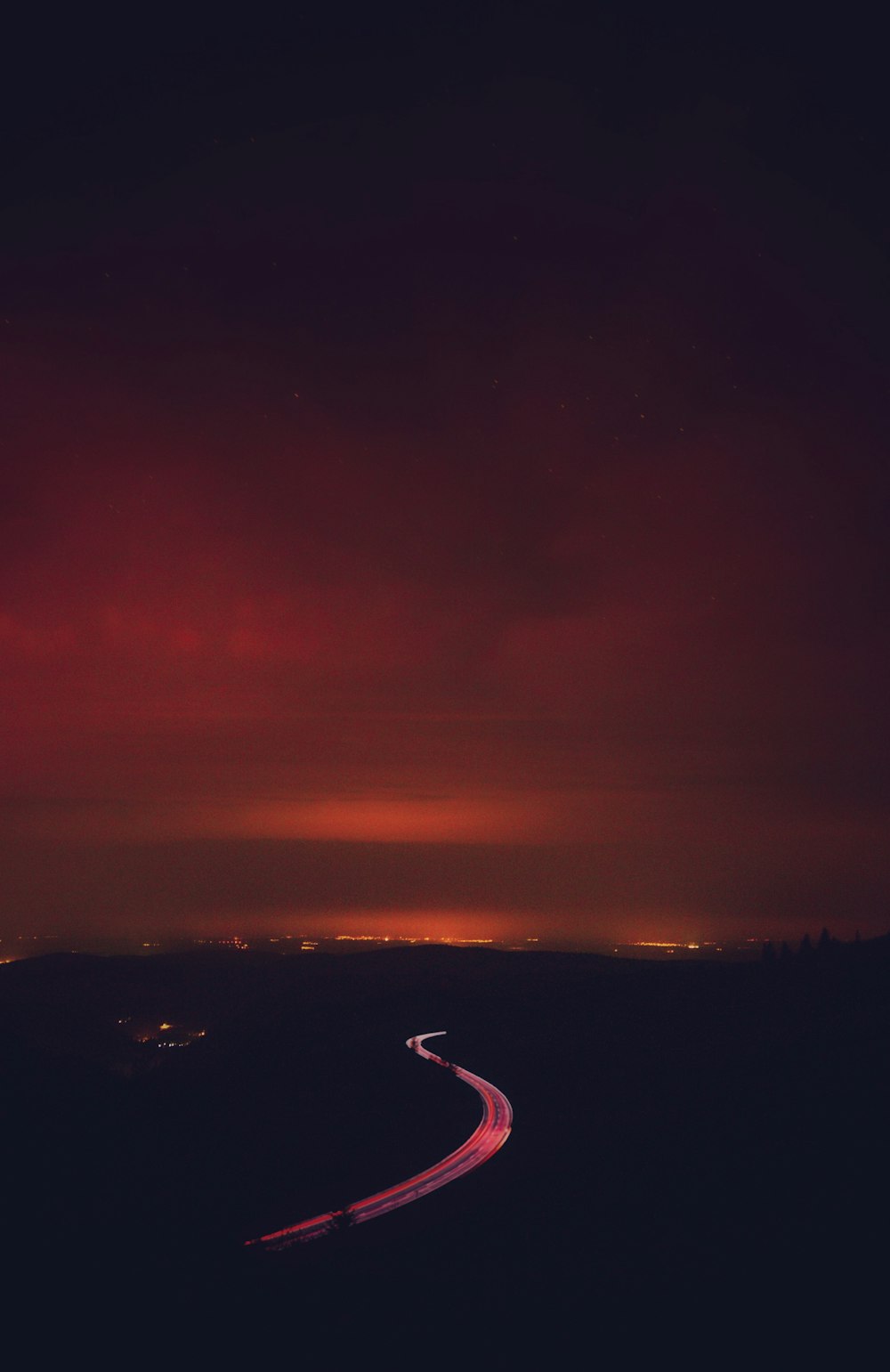 road under grey clouds