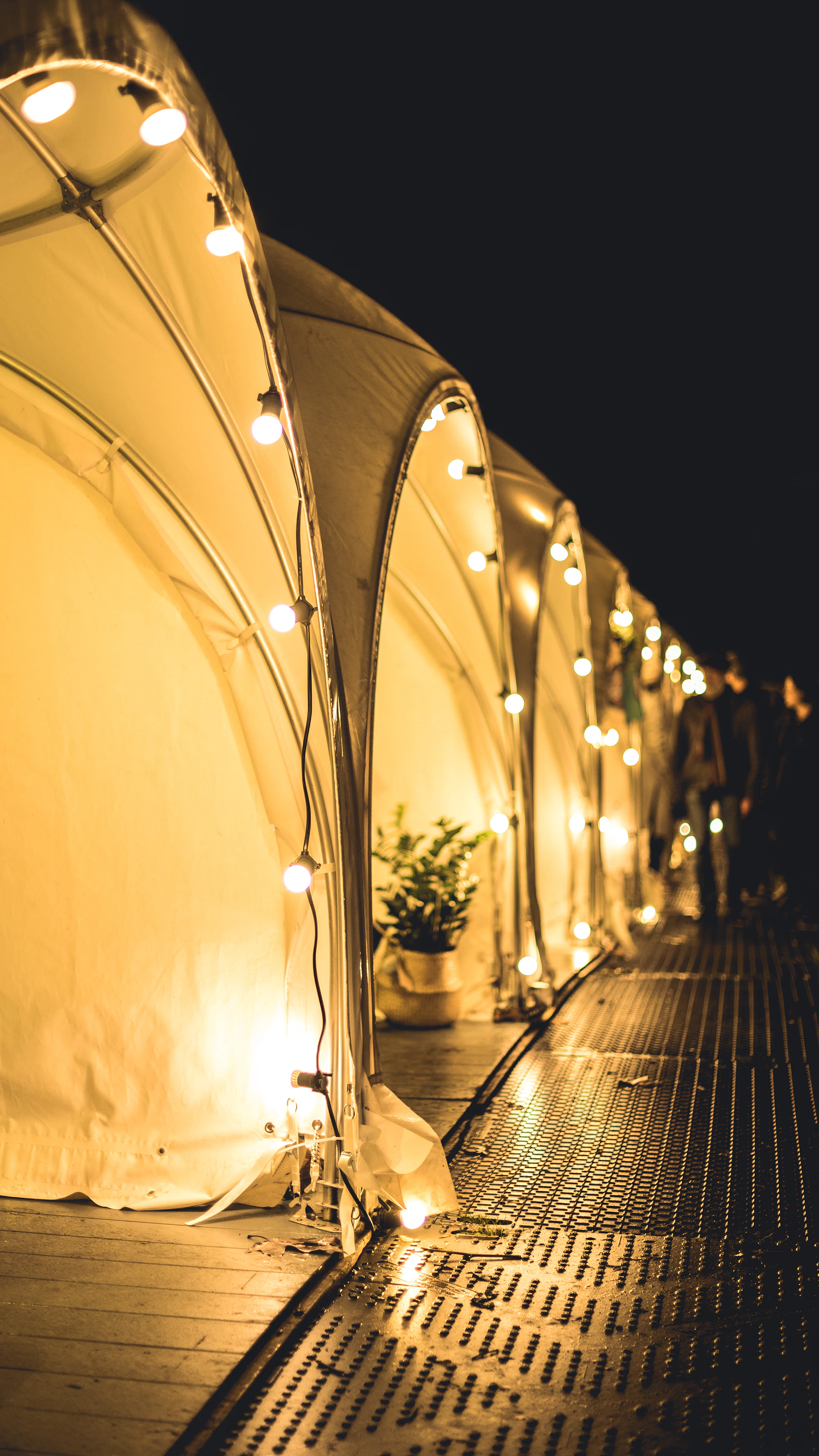 Event tents lit up at night