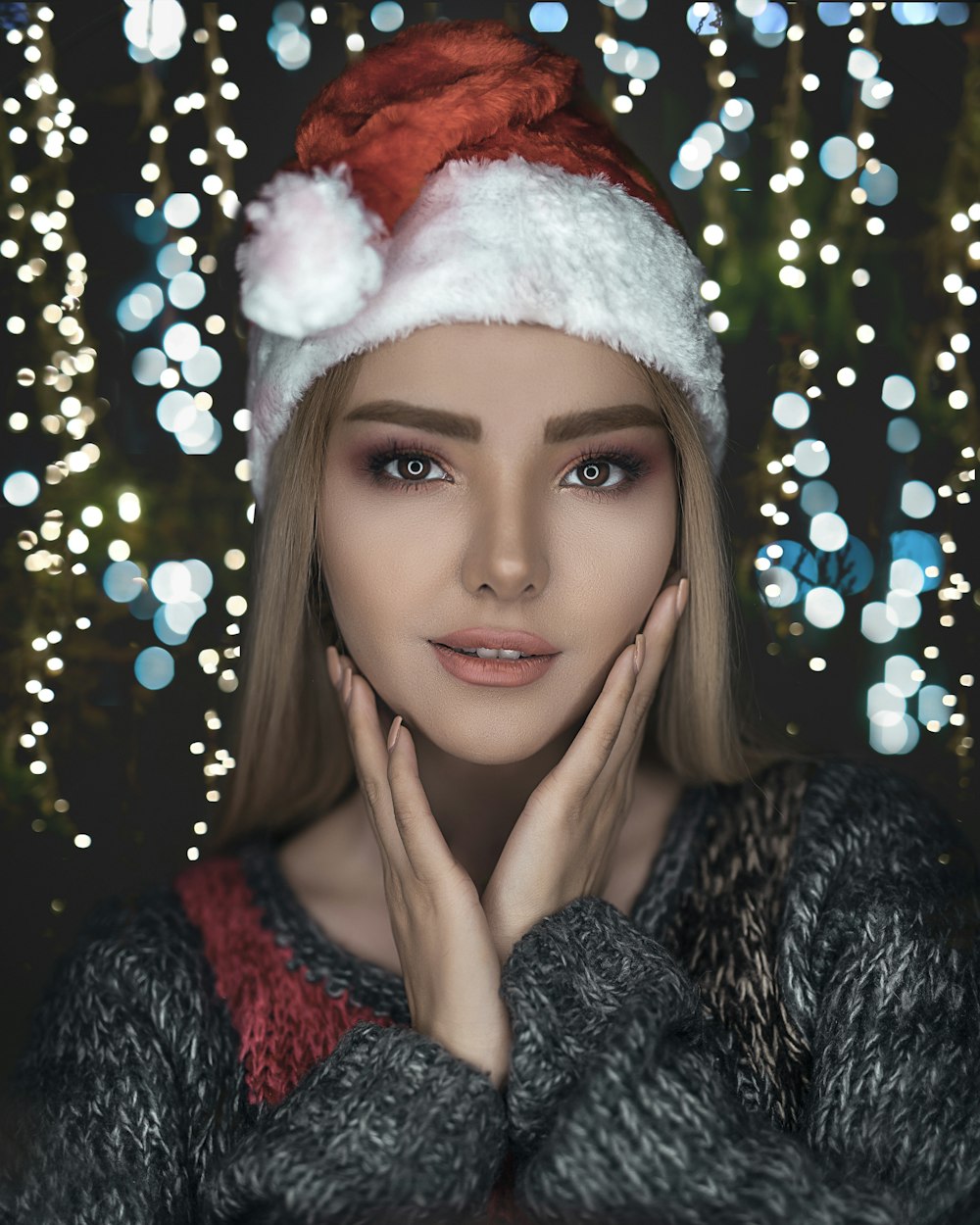 woman wearing black sweater and Santa hat