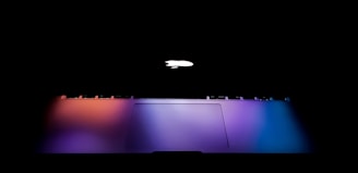 silver MacBook with lights