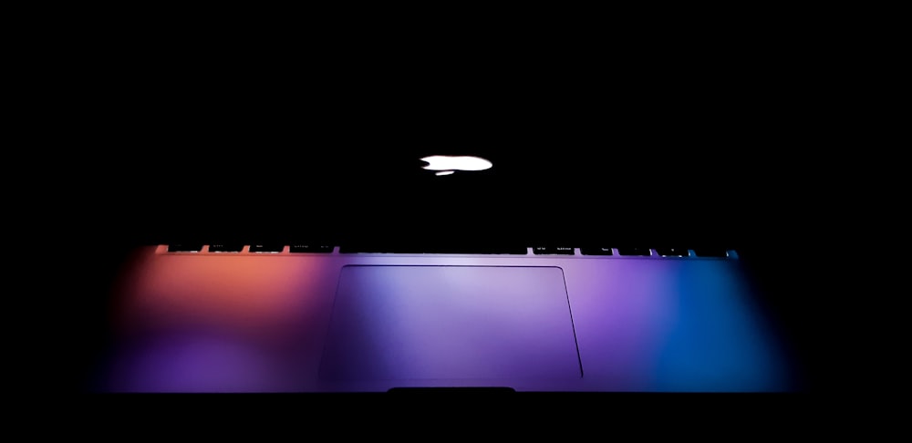 silver MacBook with lights