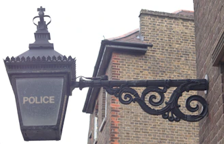 black metal Police sign