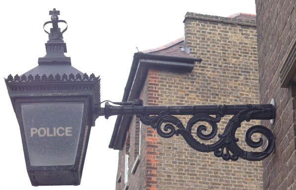 black metal Police sign