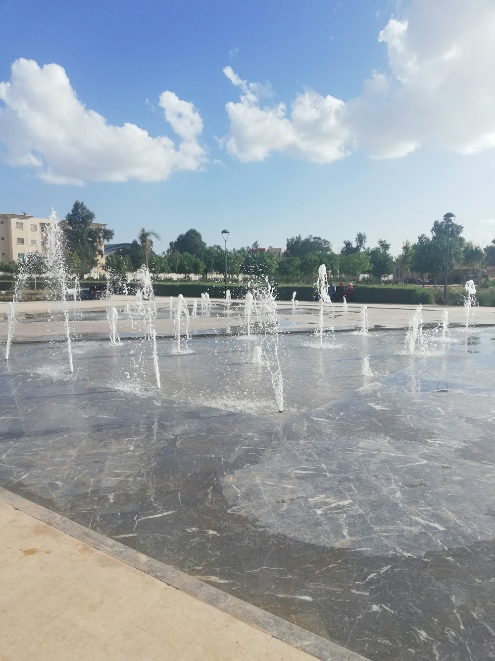 water fountain under white cloud