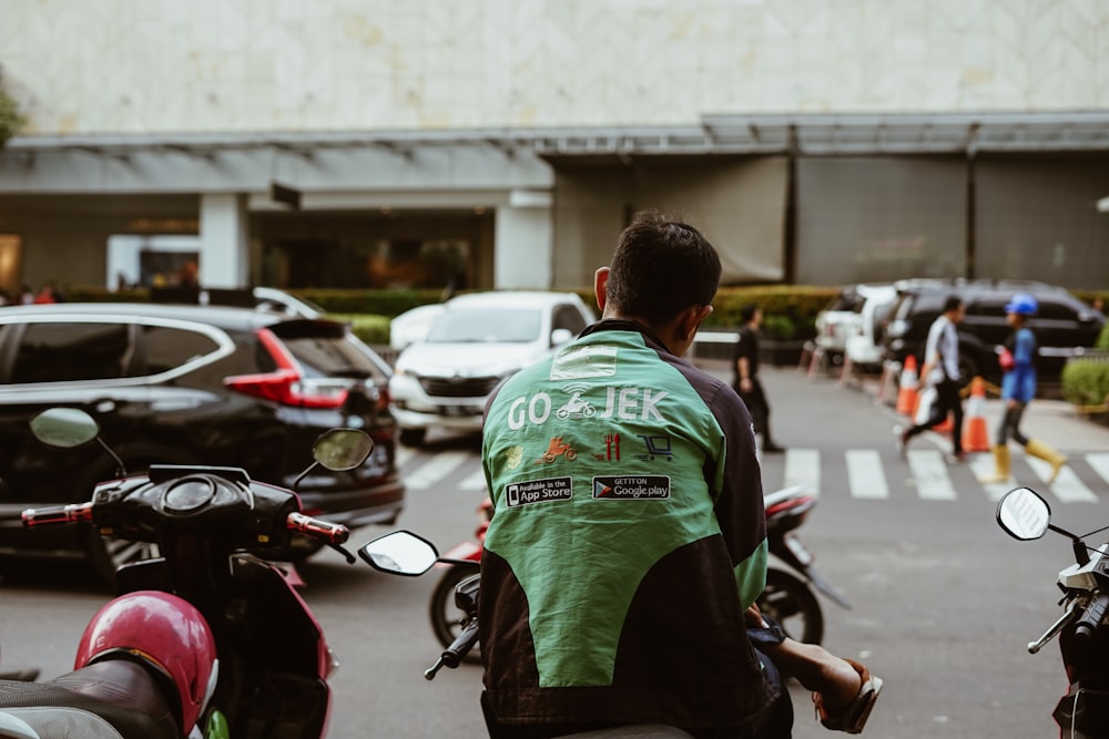 man sitting on motorcycle