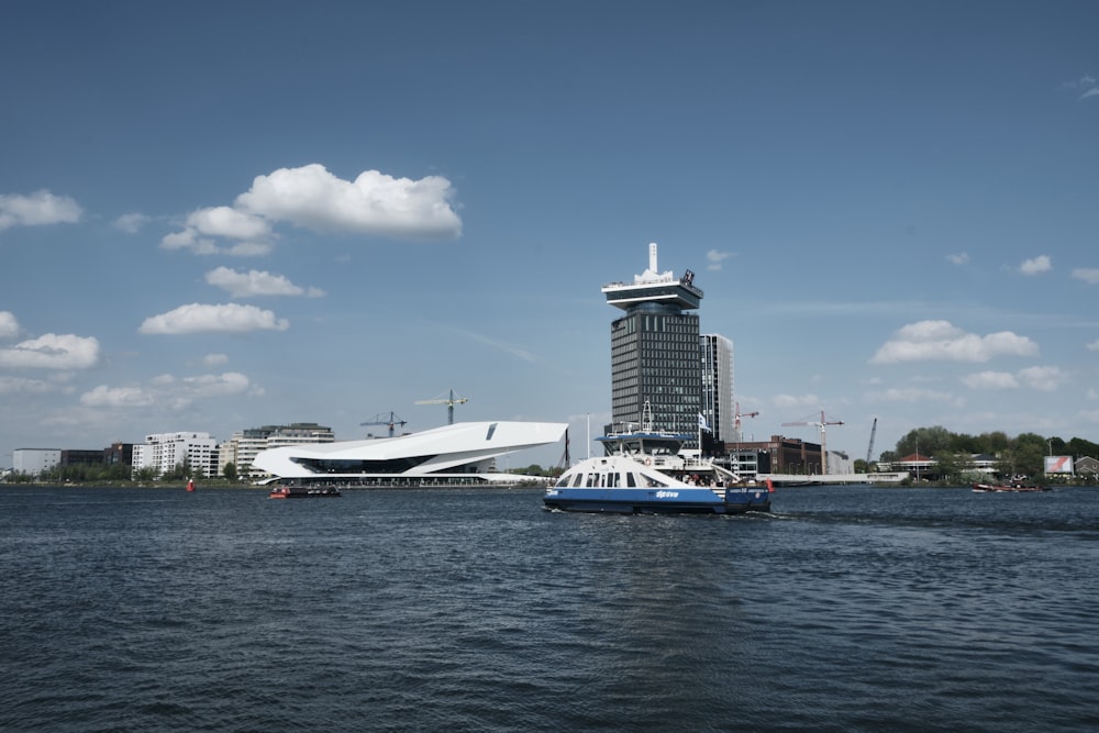 white boat doced near building