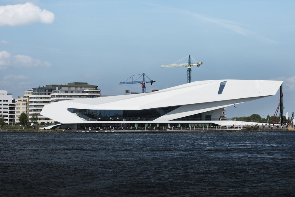 white boat shaped building near beach