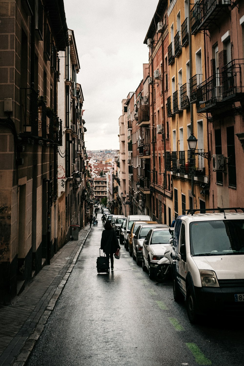 vehicles parked beside buildings