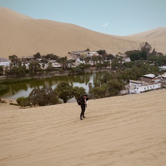 man standing near body of water