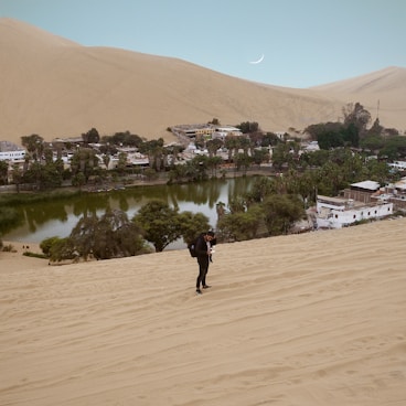 man standing near body of water