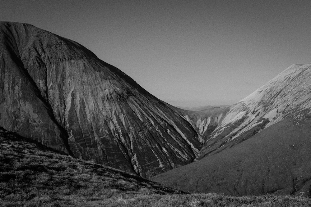 grayscale photography of mountain range