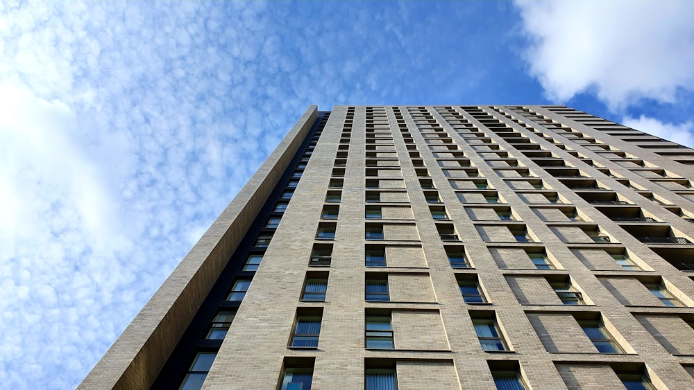 low-angle photography of brown high-rise building