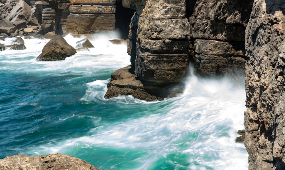 boulders on body of water