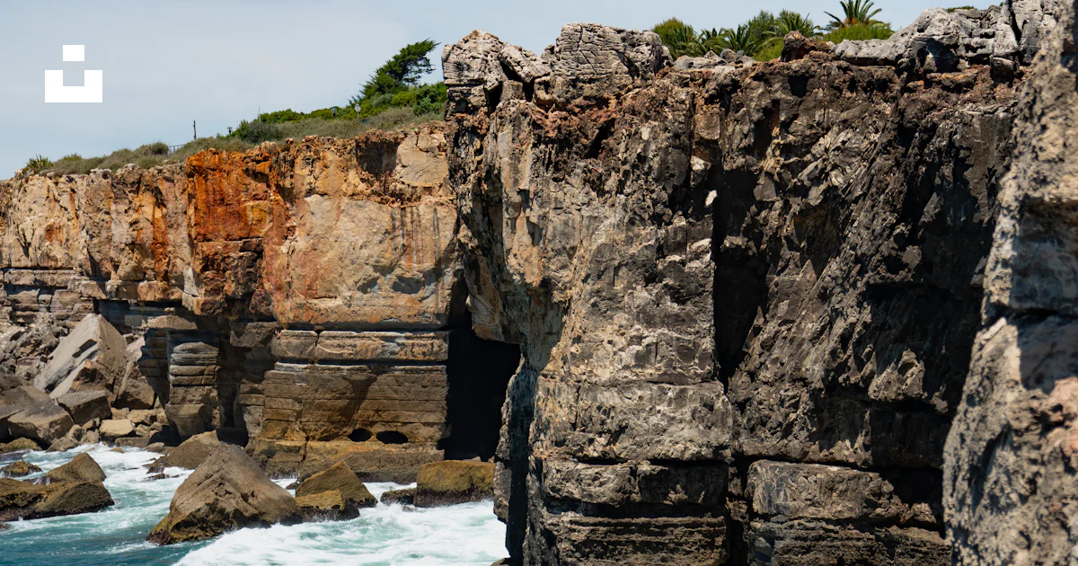 Gray cliff during daytime photo – Free Cascais Image on Unsplash