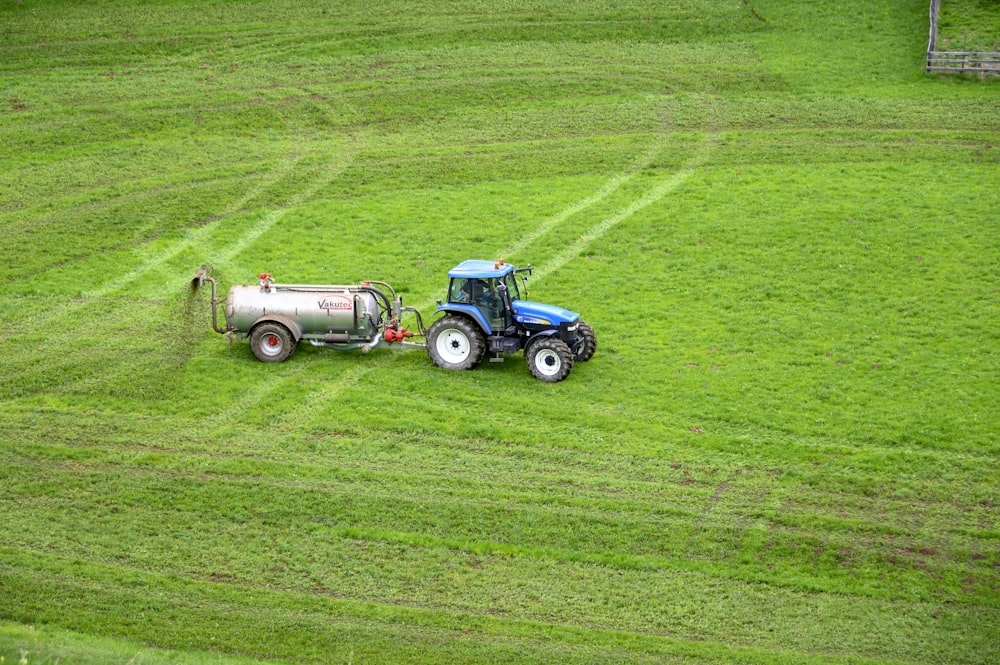 brown tractor on green grass field