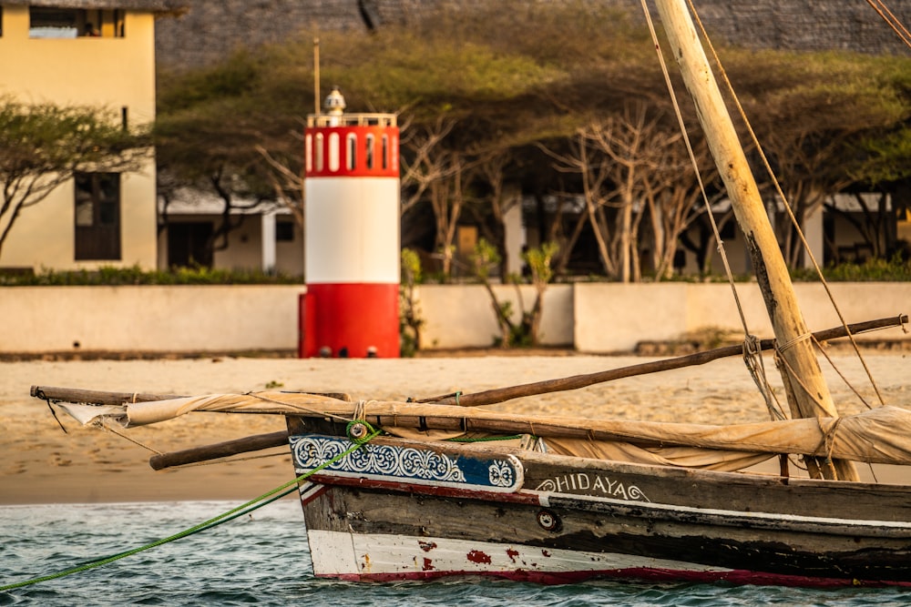 brown and white paddleboat on shoreline