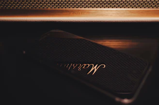 Elegant booking interface on a smartphone screen with golden accents and dark theme.