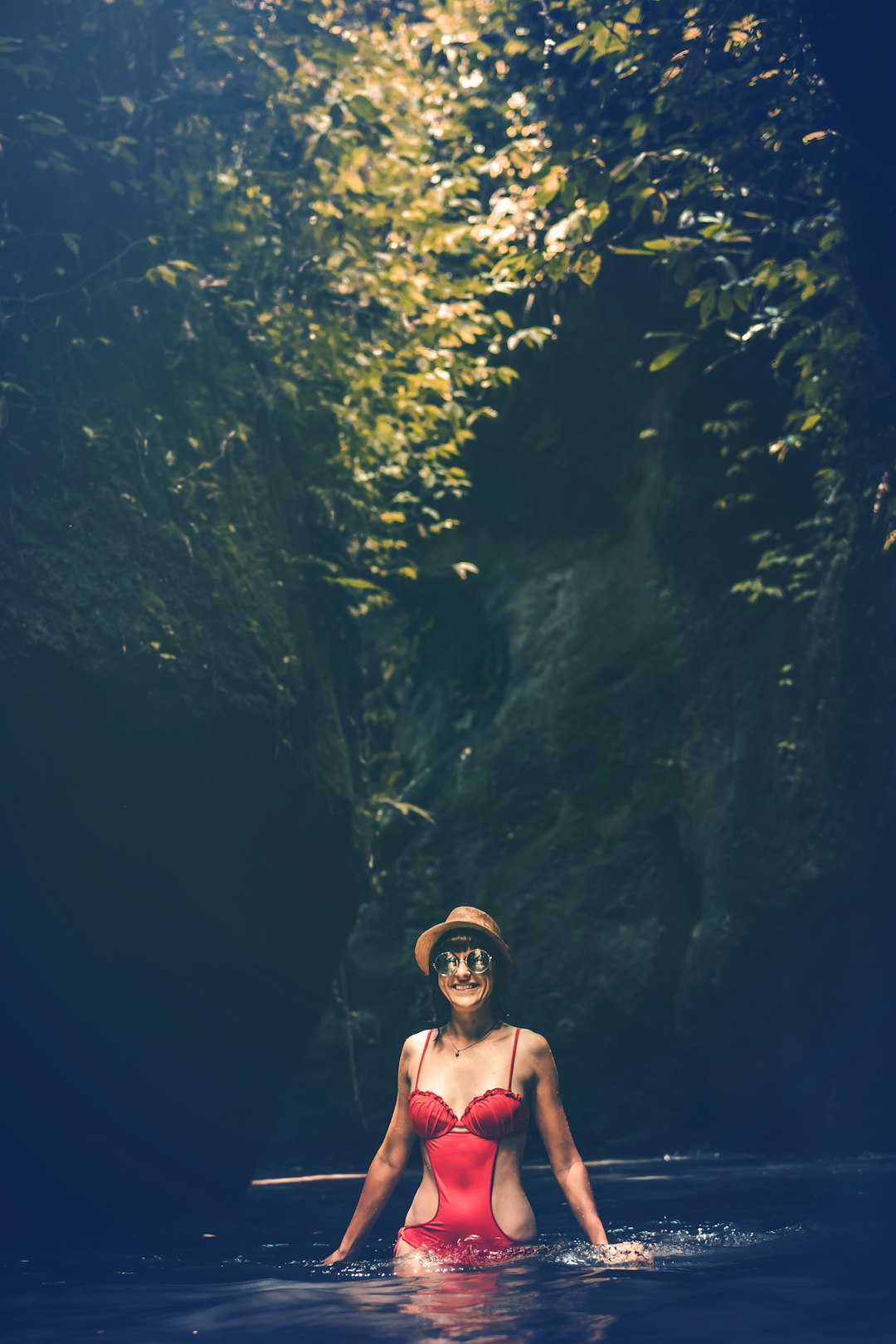 woman wearing red monokini on body of water