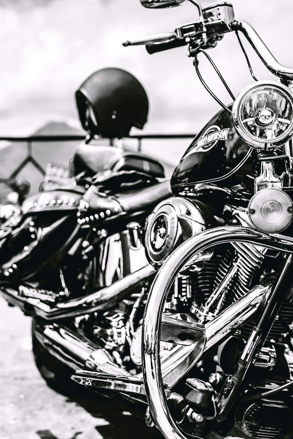 black motorcycle in grayscale photo