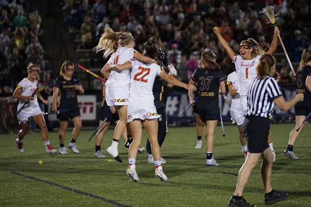 A group of young female water polo players celebrating a hard-earned victory together.