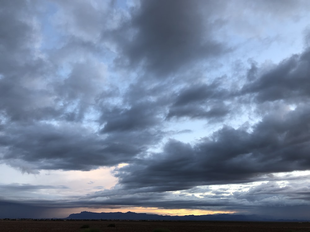 calm sea under cloud formation