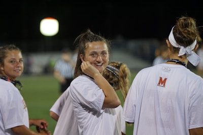 Close-up of smiling teens wearing sporty clothes, showing positive energy