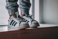 A child mimicking a digital twin tying shoelaces in a cozy home setting.