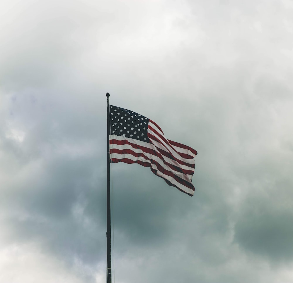USA flag under grey sky