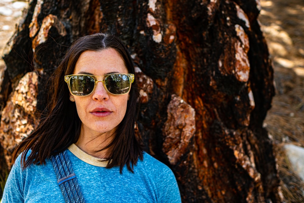 woman beside tree