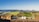 A scenic view of a sustainable farm with crops and livestock.