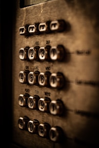 Close-up of a phone keypad with glowing numbers representing DID services.