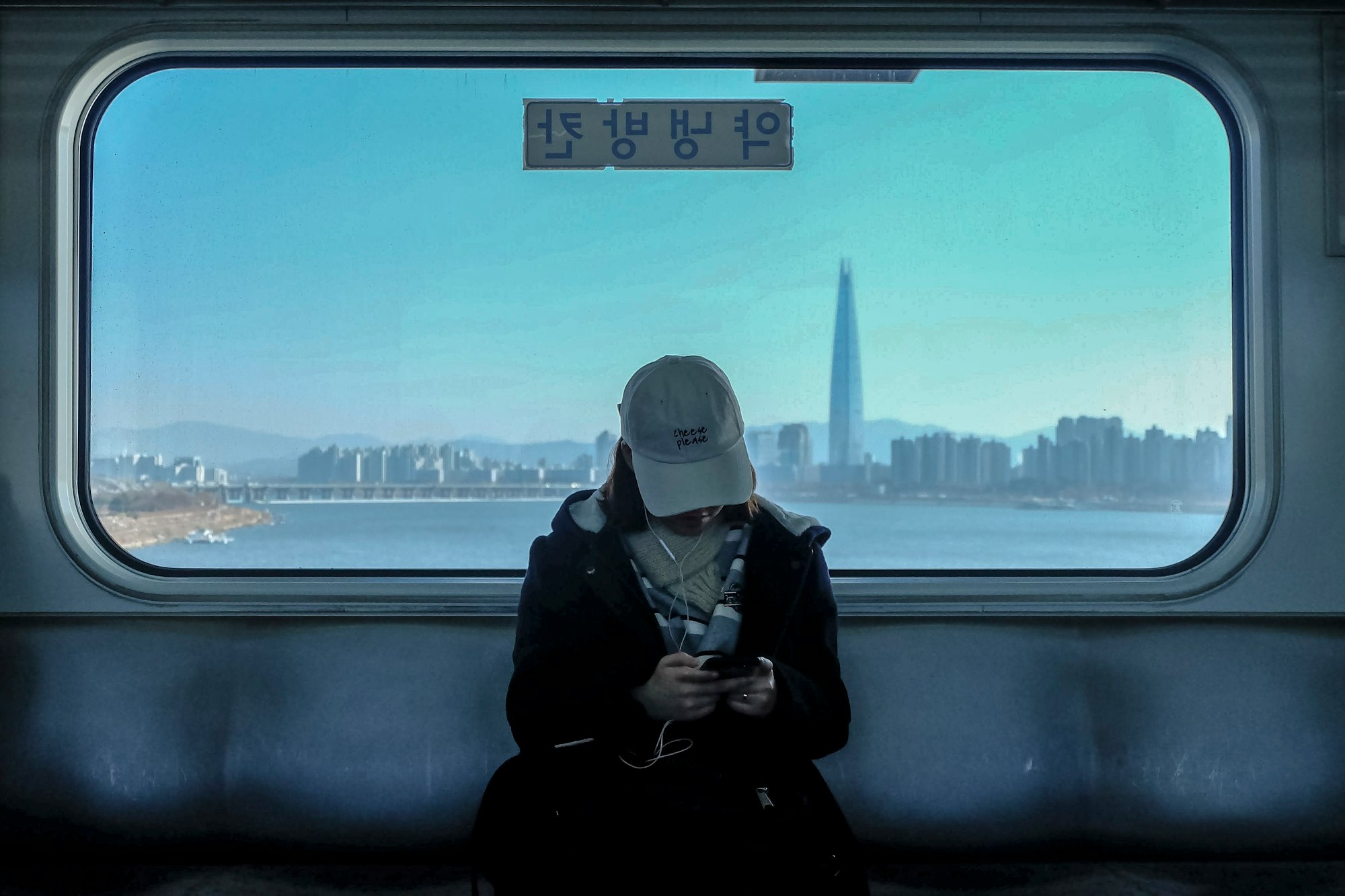 Girl in the train. Overlooking Gangnam.