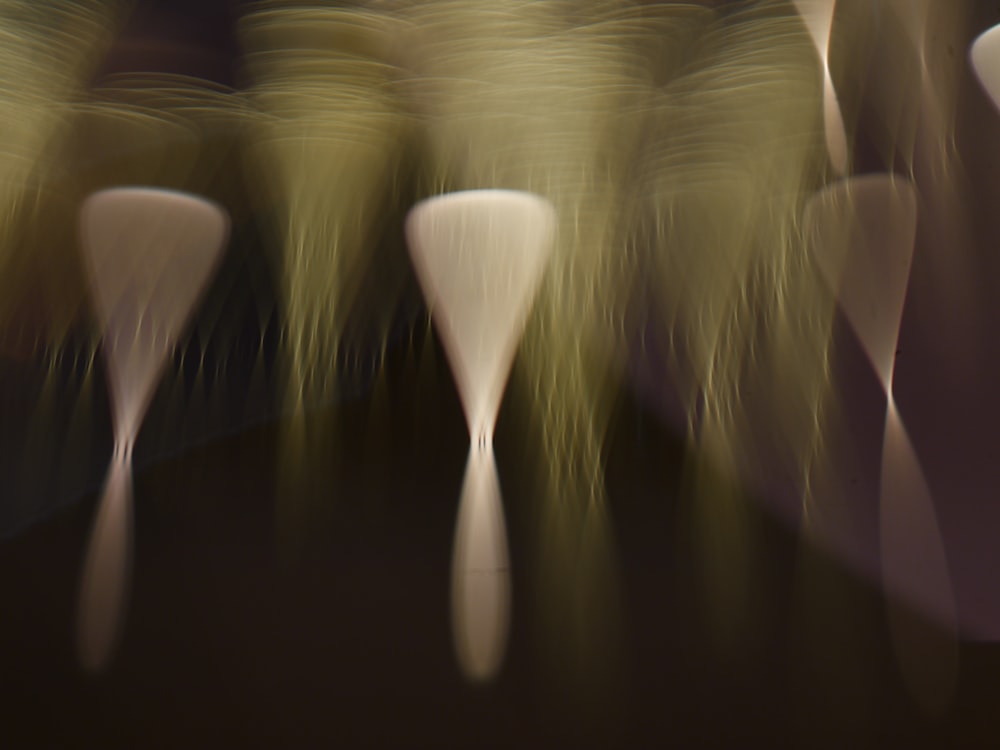 a group of white vases sitting on top of a table