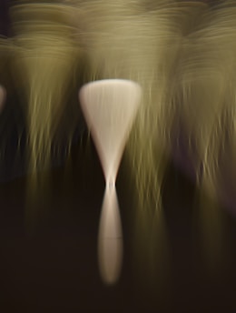 a group of white vases sitting on top of a table