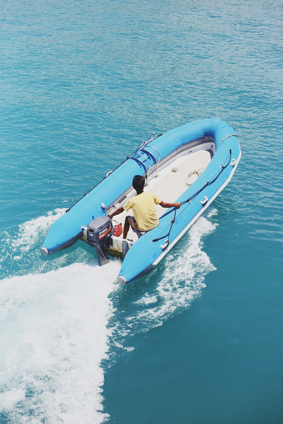 man riding inflatable powerboat