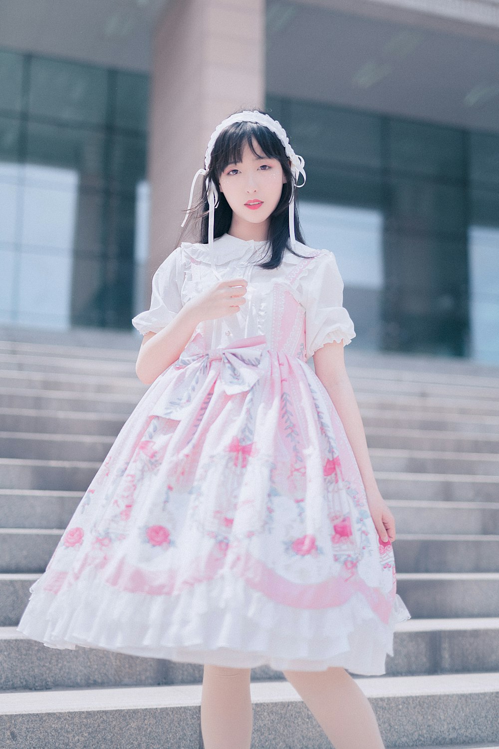 woman wearing white and pink floral dress