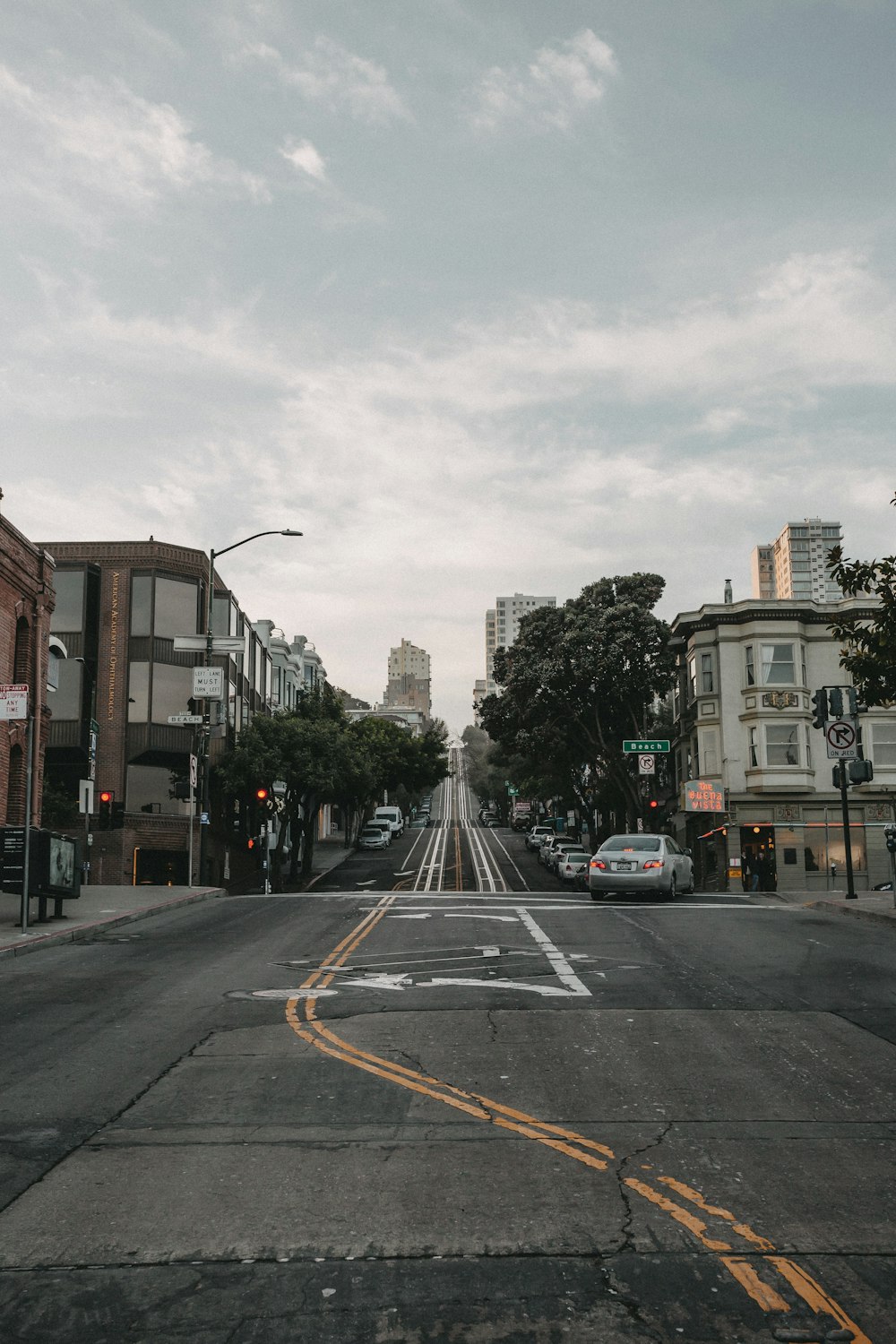 gray car on paved road