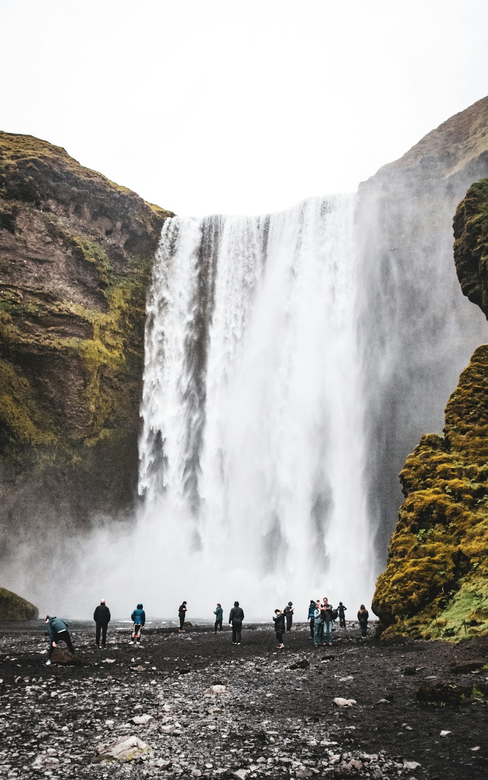 people watching waterfalls during daytime