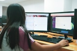 woman using desktop computer