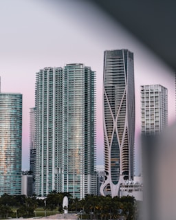 Modern cityscape in Zambia blending sleek architecture with colorful African patterns at dusk.