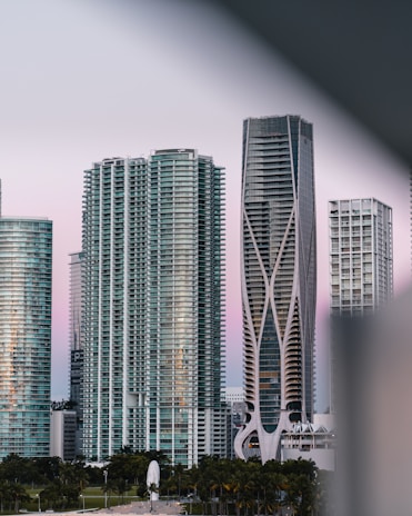 Modern cityscape in Zambia blending sleek architecture with colorful African patterns at dusk.